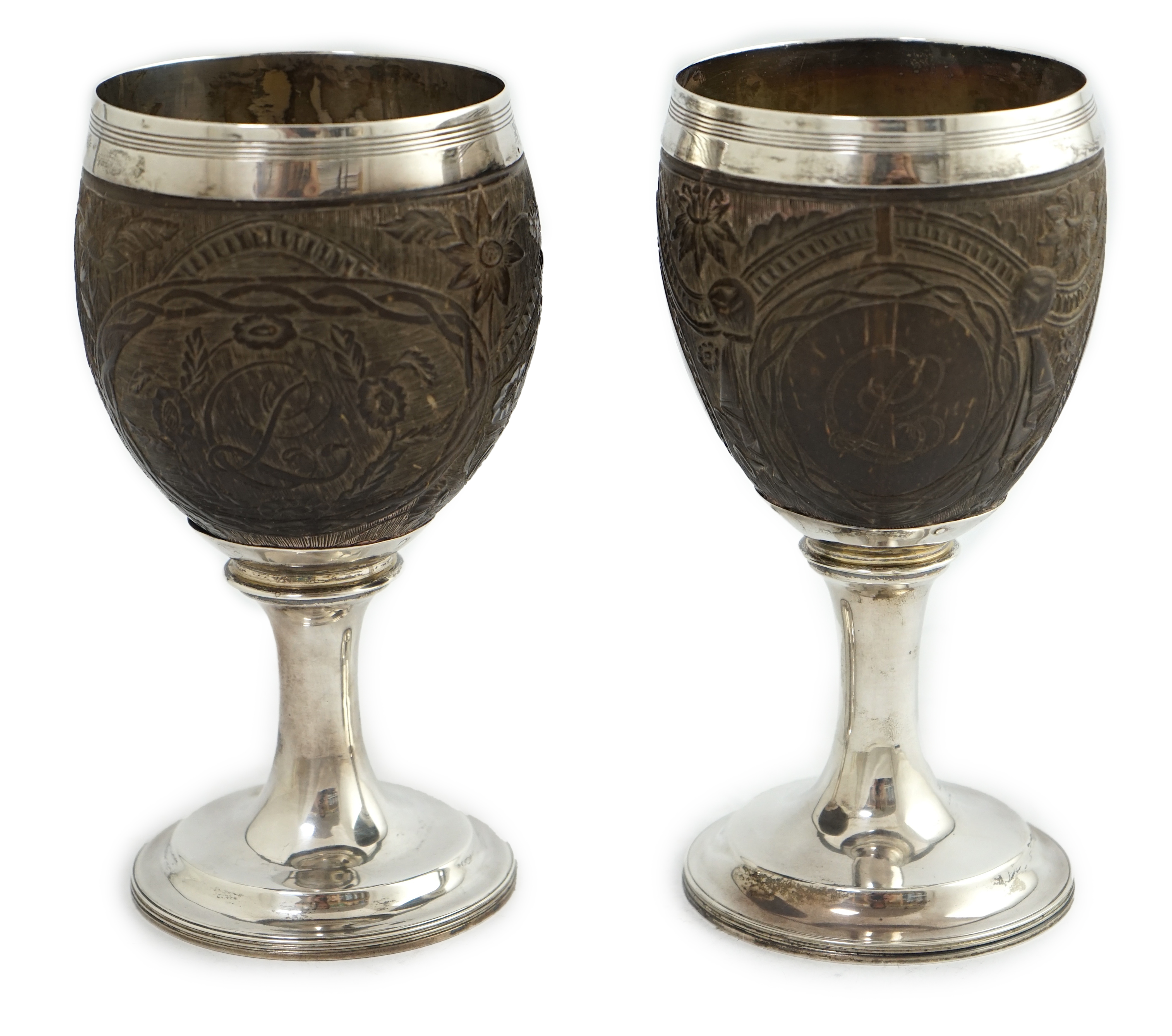 A pair of George III silver mounted coconut cups, maker I.T?